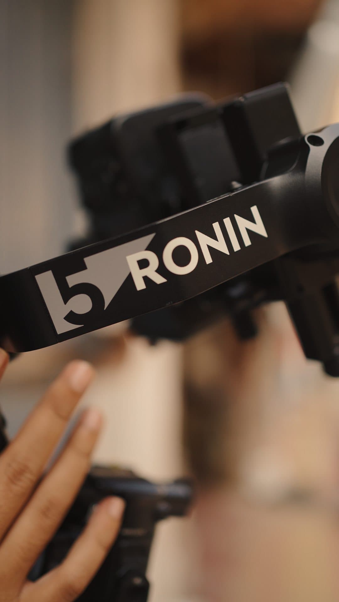 Close-up of a hand on a DJI Ronin gimbal